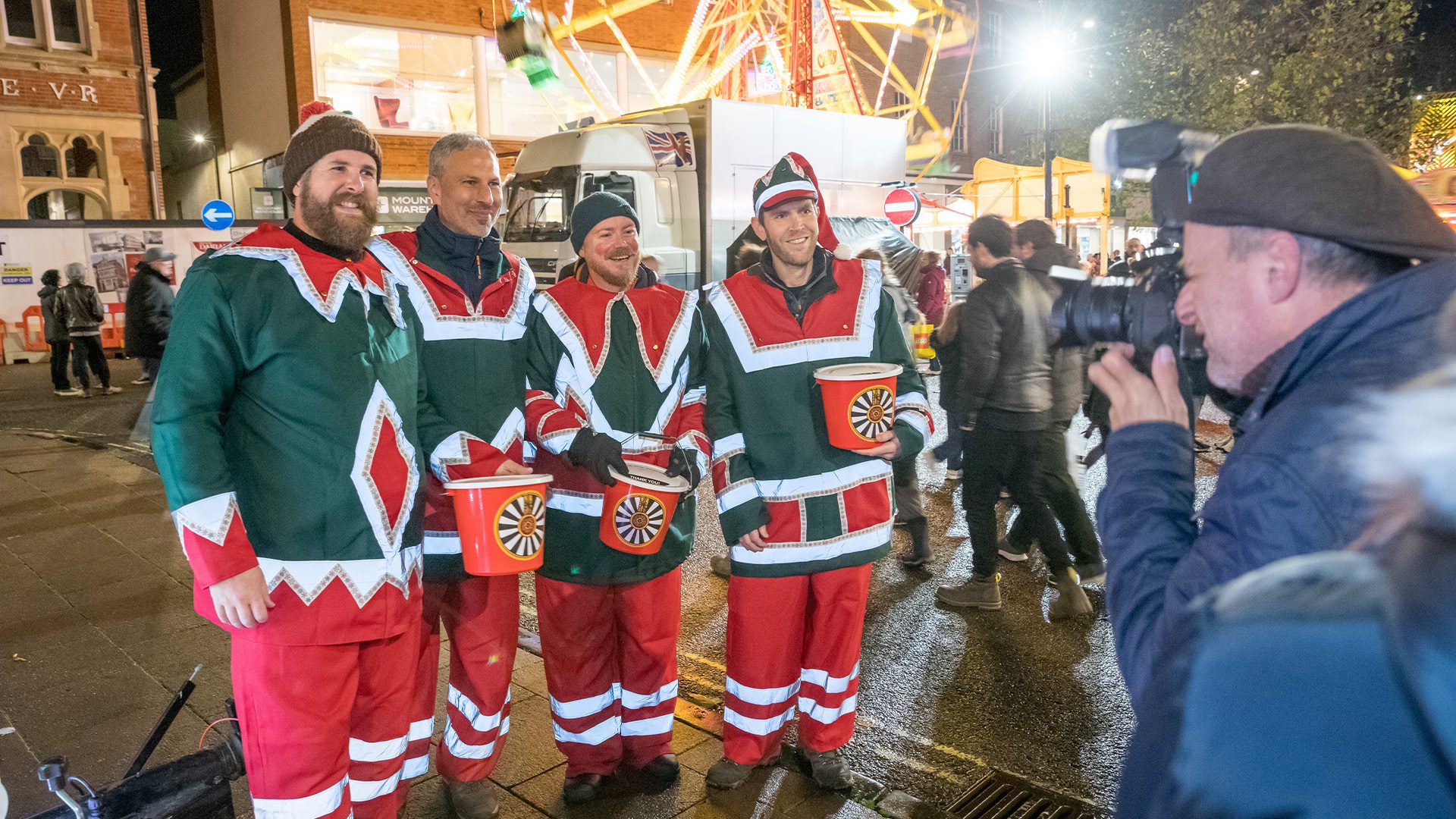 A group of male volunteers are dressed up as elves
