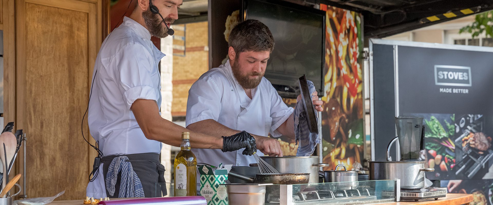 two men are doing a cooking demonstration
